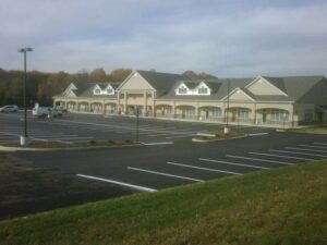 A parking lot near a commercial building.