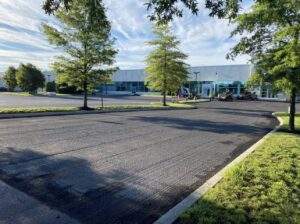 Milled asphalt parking lot and drop-off lane prepared for resurfacing at a school facility by Stanley Paving in NJ and PA.