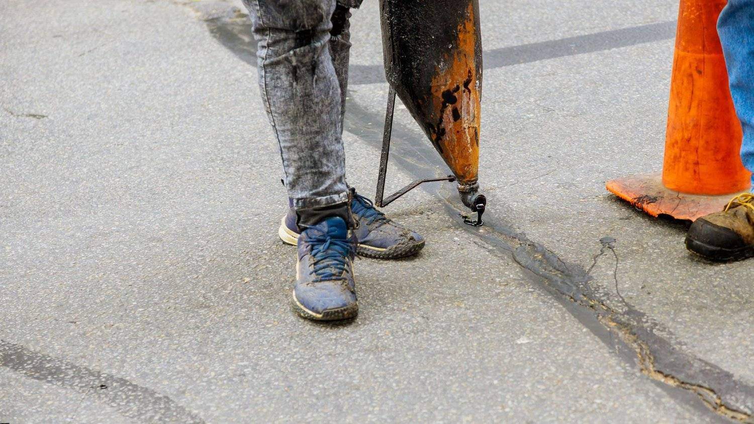 Crack sealing application on a commercial parking lot